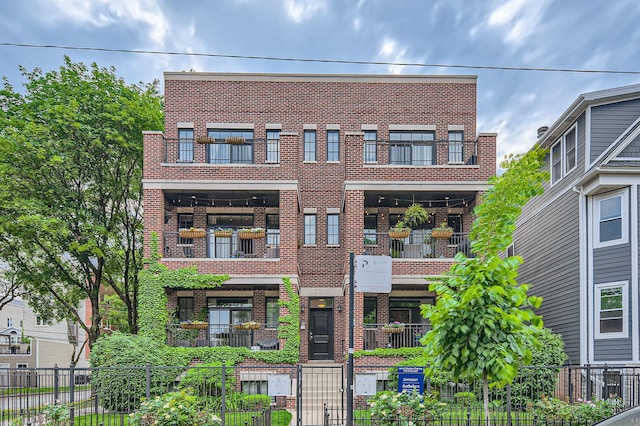 2700 N Wayne Ave Unit 2N, Chicago, IL 60614 - view of front of home featuring brick siding and a fenced front yard