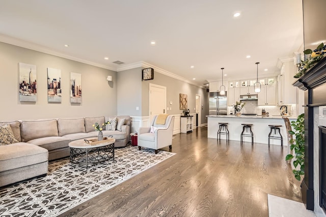 2700 N Wayne Ave Unit 2N, Chicago, IL 60614 - living room featuring recessed lighting, ornamental molding, and dark wood finished floors