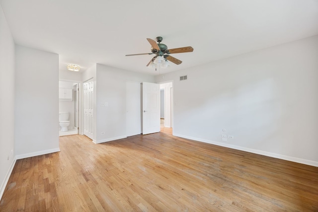 1094 E Algonquin Rd, Des Plaines, IL 60016 - unfurnished bedroom featuring baseboards, light wood finished floors, ensuite bath, and a closet