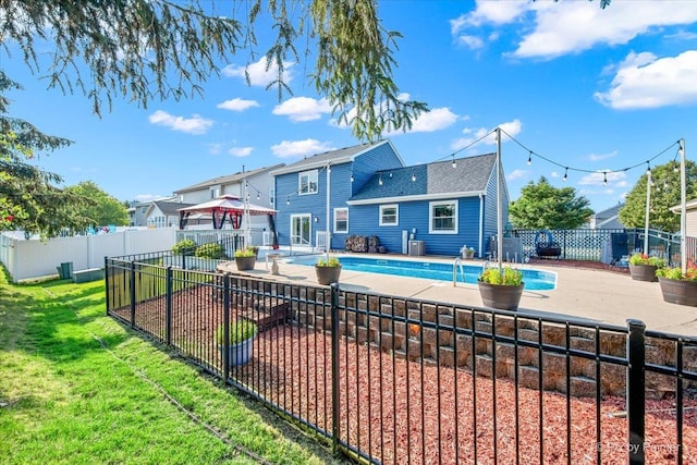 688 Regent Dr, Crystal Lake, IL 60014 - rear view of property featuring a gazebo, a fenced backyard, a shingled roof, and a patio area