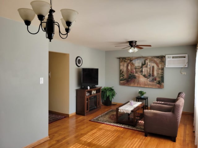 3023 Paris Ave Unit 207, River Grove, IL 60171 - living area with an AC wall unit, wood finished floors, ceiling fan, a chandelier, and baseboards