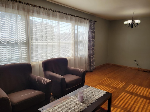 3023 Paris Ave Unit 207, River Grove, IL 60171 - living room with a chandelier, wood finished floors, and baseboards