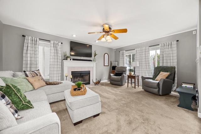 2278 Andrew Trl, Montgomery, IL 60538 - living area featuring ceiling fan, a tiled fireplace, and carpet flooring