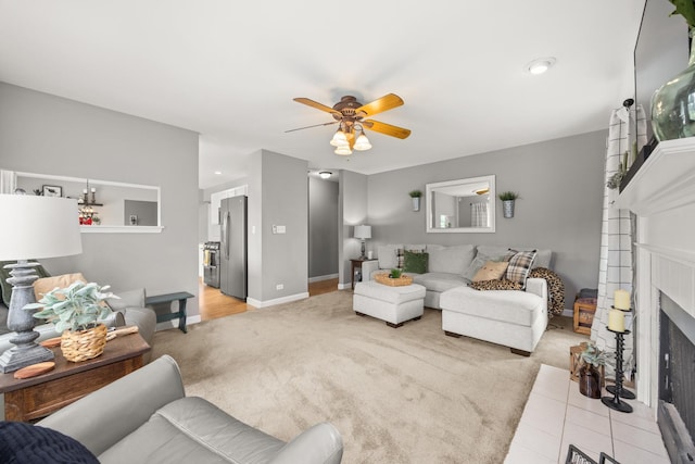 2278 Andrew Trl, Montgomery, IL 60538 - living room with light colored carpet, ceiling fan, and a fireplace
