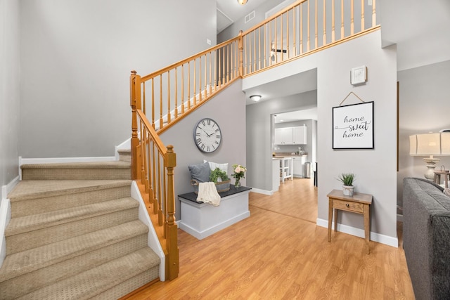 2278 Andrew Trl, Montgomery, IL 60538 - staircase with wood finished floors and a towering ceiling