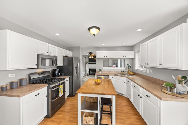 2278 Andrew Trl, Montgomery, IL 60538 - kitchen featuring appliances with stainless steel finishes, a ceiling fan, white cabinetry, and recessed lighting