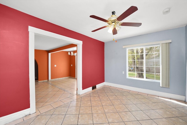 2203 Gilead Ave, Zion, IL 60099 - spare room featuring baseboards, light tile patterned floors, ceiling fan, a smoke detector, and a chandelier