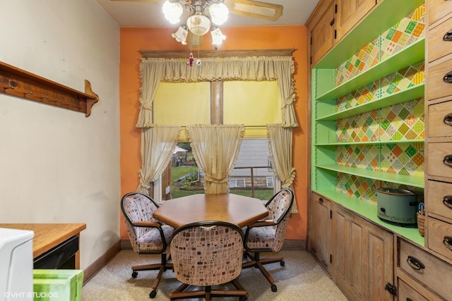 309 E Corning Ave, Peotone, IL 60468 - dining space featuring a ceiling fan, light colored carpet, and baseboards