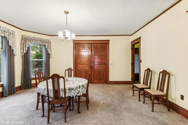 309 E Corning Ave, Peotone, IL 60468 - dining area featuring light carpet, a chandelier, crown molding, and baseboards