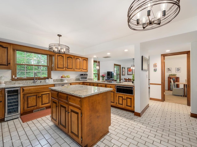 77 Mark Dr, Hawthorn Woods, IL 60047 - kitchen with beverage cooler, a chandelier, brown cabinetry, a warming drawer, and recessed lighting