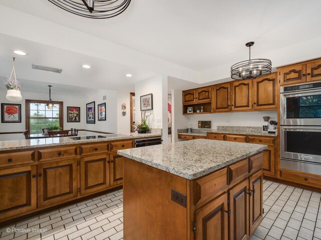 77 Mark Dr, Hawthorn Woods, IL 60047 - kitchen featuring black appliances, brown cabinetry, a kitchen island, recessed lighting, and hanging light fixtures