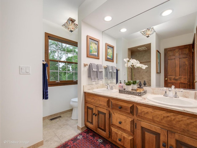 77 Mark Dr, Hawthorn Woods, IL 60047 - bathroom featuring double vanity, tiled shower, tile patterned flooring, and recessed lighting