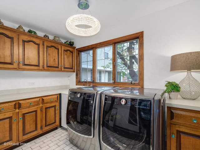 77 Mark Dr, Hawthorn Woods, IL 60047 - laundry room featuring washer and dryer, cabinet space, and a chandelier