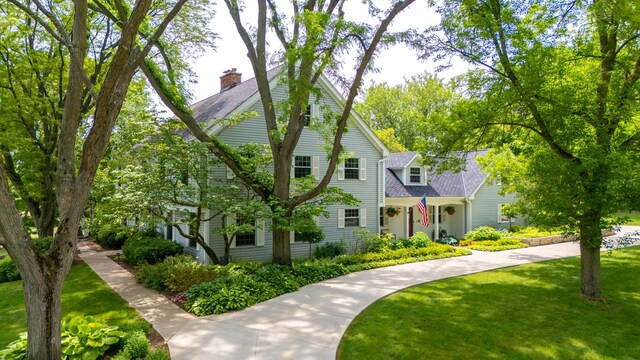77 Mark Dr, Hawthorn Woods, IL 60047 - view of front of property featuring a front lawn, a chimney, and a shingled roof