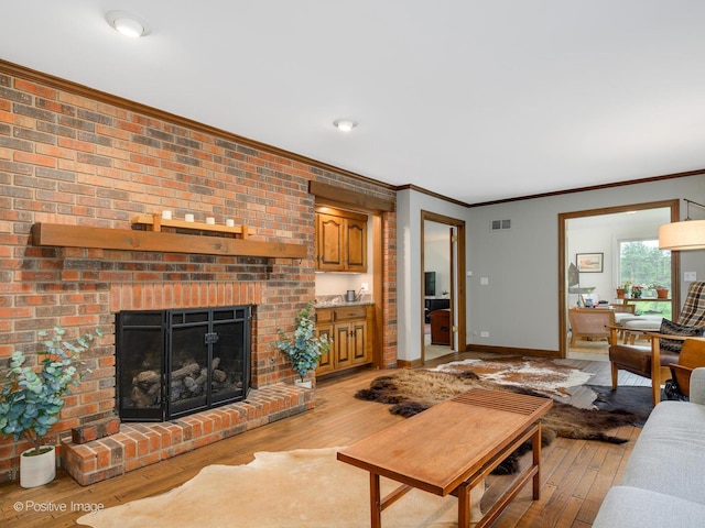 77 Mark Dr, Hawthorn Woods, IL 60047 - living area featuring crown molding, light wood-style flooring, and a fireplace