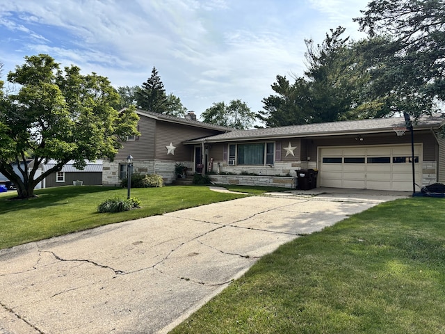 205 Beacon Dr, Belvidere, IL 61008 - tri-level home with stone siding, an attached garage, concrete driveway, a front lawn, and a chimney