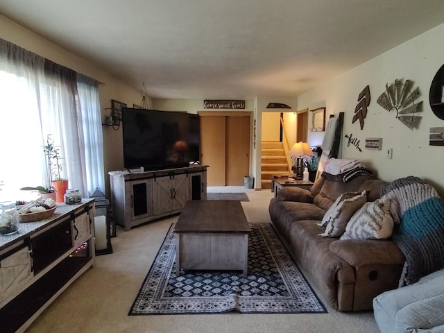 205 Beacon Dr, Belvidere, IL 61008 - living area with stairway and light colored carpet