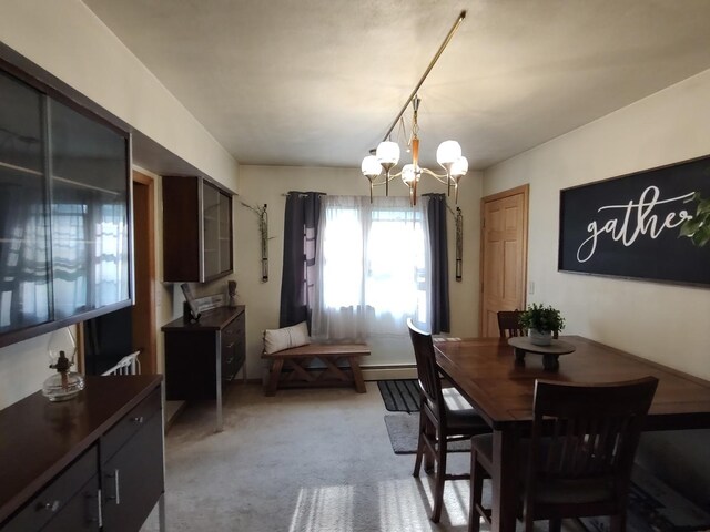 205 Beacon Dr, Belvidere, IL 61008 - dining area with a chandelier, a baseboard heating unit, and light colored carpet