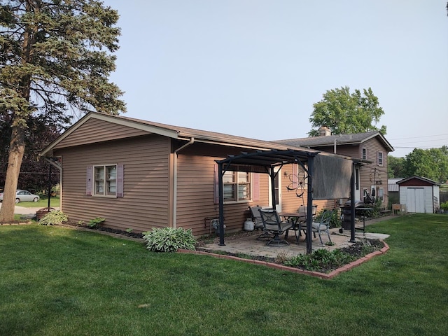 205 Beacon Dr, Belvidere, IL 61008 - back of property with a patio and a lawn