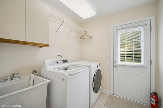 4045 N Harvard Ave, Arlington Heights, IL 60004 - washroom featuring washer and clothes dryer, cabinet space, light tile patterned floors, and baseboards