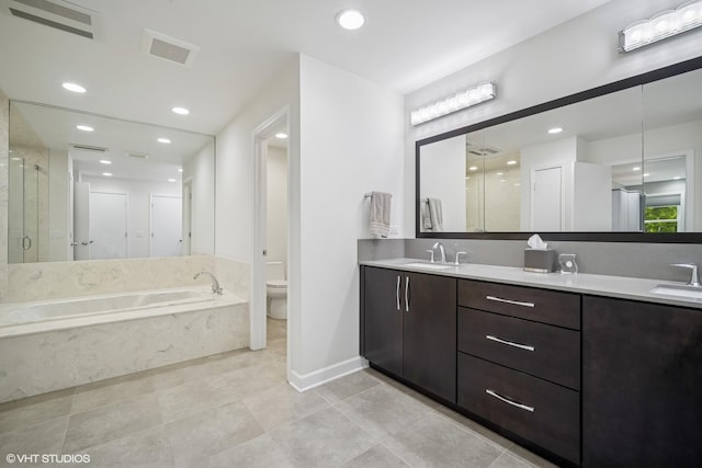 4045 N Harvard Ave, Arlington Heights, IL 60004 - bathroom with a bath, toilet, a shower stall, double vanity, and tile patterned flooring