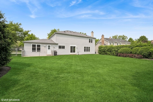 4045 N Harvard Ave, Arlington Heights, IL 60004 - rear view of property featuring a shingled roof and a chimney