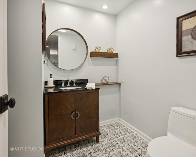 680 N Lake Shore Dr Unit 220, Chicago, IL 60611 - bathroom featuring toilet, vanity, baseboards, tile patterned flooring, and recessed lighting