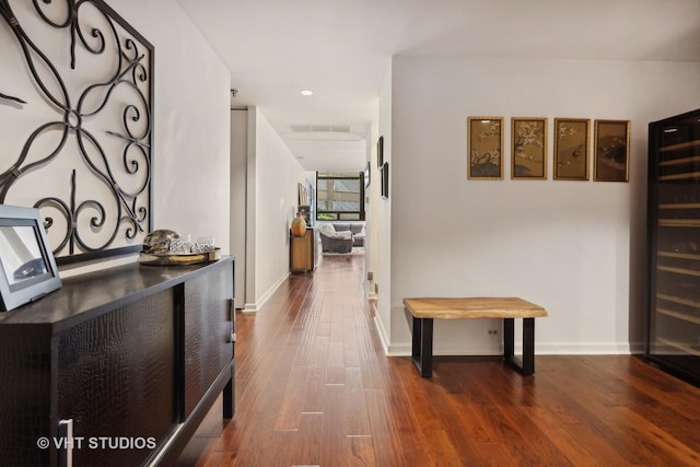 680 N Lake Shore Dr Unit 220, Chicago, IL 60611 - corridor featuring dark wood-style flooring, baseboards, recessed lighting, and beverage cooler