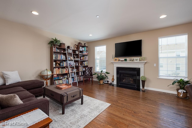 1878 Roseland Ln, Hoffman Estates, IL 60192 - living room with wood finished floors, recessed lighting, and a fireplace with flush hearth