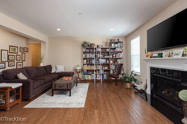 1878 Roseland Ln, Hoffman Estates, IL 60192 - living room featuring wood finished floors, a glass covered fireplace, and recessed lighting