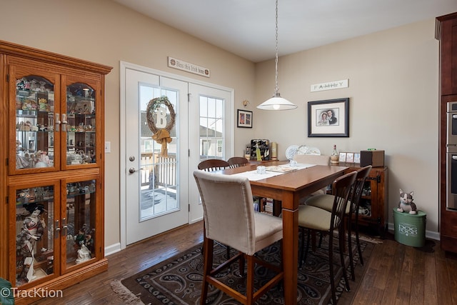 1878 Roseland Ln, Hoffman Estates, IL 60192 - dining area with dark wood-style floors and baseboards