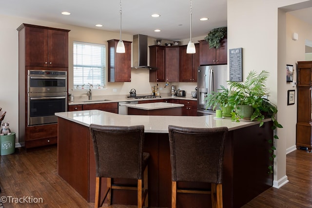 1878 Roseland Ln, Hoffman Estates, IL 60192 - kitchen with wall chimney range hood, stainless steel appliances, a kitchen island, dark wood-style floors, and recessed lighting