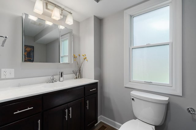 592 E 13th St, Lockport, IL 60441 - half bathroom featuring vanity and toilet
