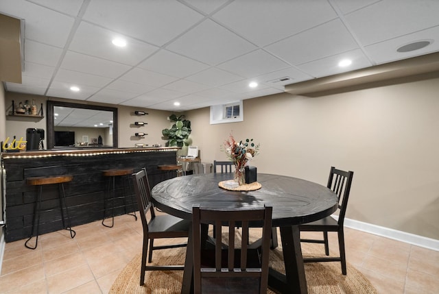 592 E 13th St, Lockport, IL 60441 - dining room featuring a bar, light tile patterned flooring, a drop ceiling, and recessed lighting