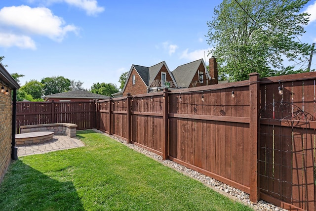 592 E 13th St, Lockport, IL 60441 - fenced yard with a patio area