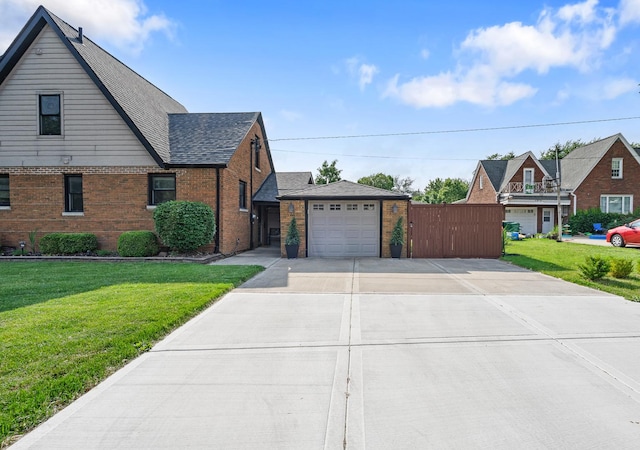 592 E 13th St, Lockport, IL 60441 - view of front of property with driveway, brick siding, and a front lawn