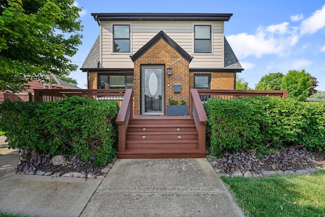 592 E 13th St, Lockport, IL 60441 - view of front of home featuring brick siding and a wooden deck