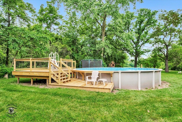 21440 S Hillside Rd, Frankfort, IL 60423 - swimming pool with a deck, a lawn, and view of wooded area