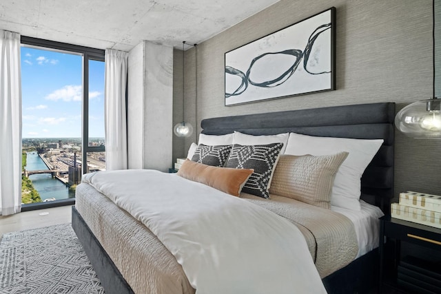 234 W Polk St Unit 3209, Chicago, IL 60607 - bedroom with a wall of windows, a water view, wood finished floors, and access to exterior