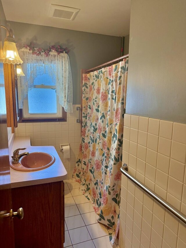 1308 Waverly Pl, Joliet, IL 60435 - bathroom featuring tile walls, tile patterned floors, vanity, a shower with curtain, and wainscoting