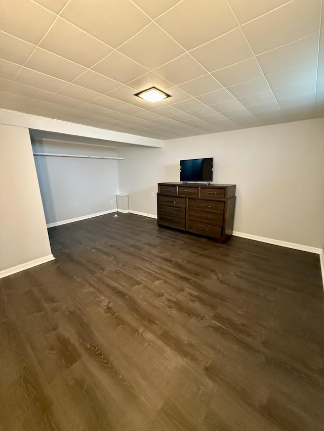 1308 Waverly Pl, Joliet, IL 60435 - unfurnished bedroom featuring dark wood-style flooring and baseboards