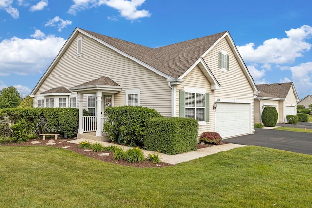 524 Prairie View Dr, Minooka, IL 60447 - traditional-style house featuring roof with shingles, asphalt driveway, a garage, and a front lawn