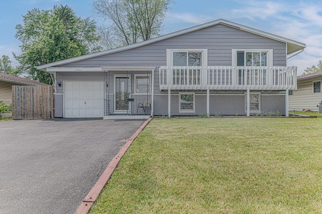 1006 Tacoma St, Carpentersville, IL 60110 - split level home featuring a garage and driveway