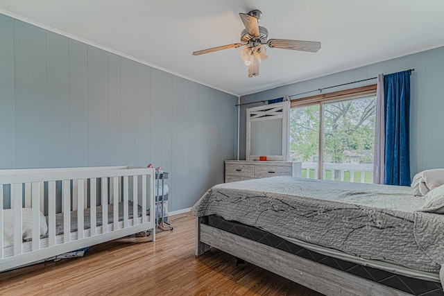 1006 Tacoma St, Carpentersville, IL 60110 - bedroom featuring wood finished floors, ornamental molding, ceiling fan, and baseboards