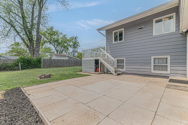 1006 Tacoma St, Carpentersville, IL 60110 - back of property with stairs, a patio, and a fire pit