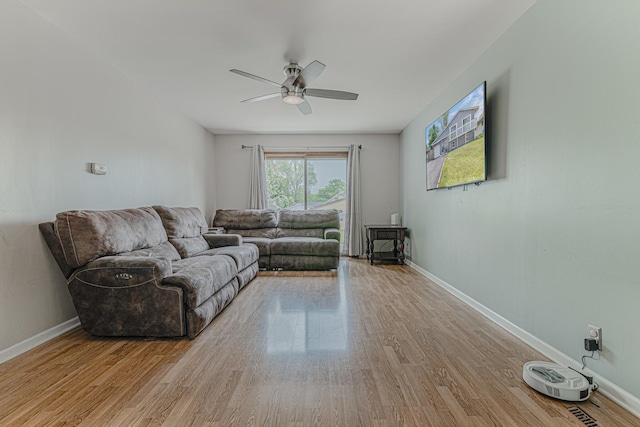 1006 Tacoma St, Carpentersville, IL 60110 - living area featuring a ceiling fan, wood finished floors, and baseboards