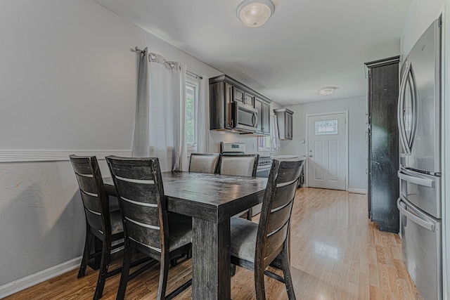1006 Tacoma St, Carpentersville, IL 60110 - dining area with light wood finished floors and baseboards