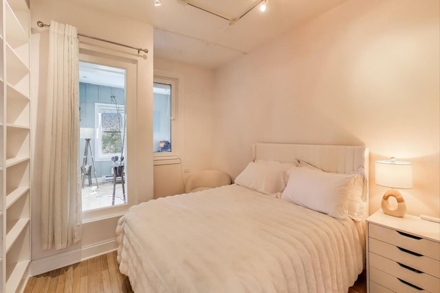 606 W Aldine Ave Unit 3E, Chicago, IL 60657 - bedroom featuring wood finished floors and baseboards