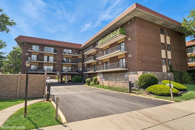 9540 S Mayfield Ave Unit 103S, Oak Lawn, IL 60453 - view of apartment building / complex featuring covered and uncovered parking