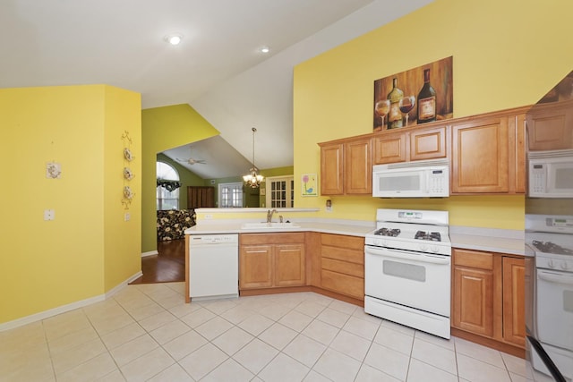 1908 Timbers Edge Cir, Joliet, IL 60431 - kitchen with white appliances, vaulted ceiling, a peninsula, light countertops, and a chandelier